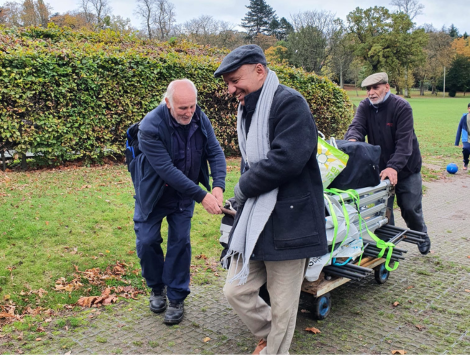 Volunteers setting up a community event in the park